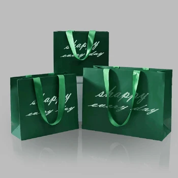 500 шт./лот высококлассных модных утолщенных многоразовых бумажных пакетов для покупок подарочной одежды с вашим собственным логотипом
